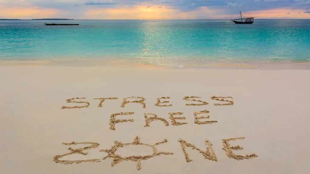 stress free weekend getaways spelled out in the sand on the beach
